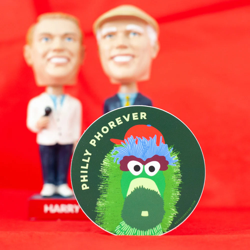 Bobbleheads with a close-up of a 'Philly Phorever' sticker on a red background